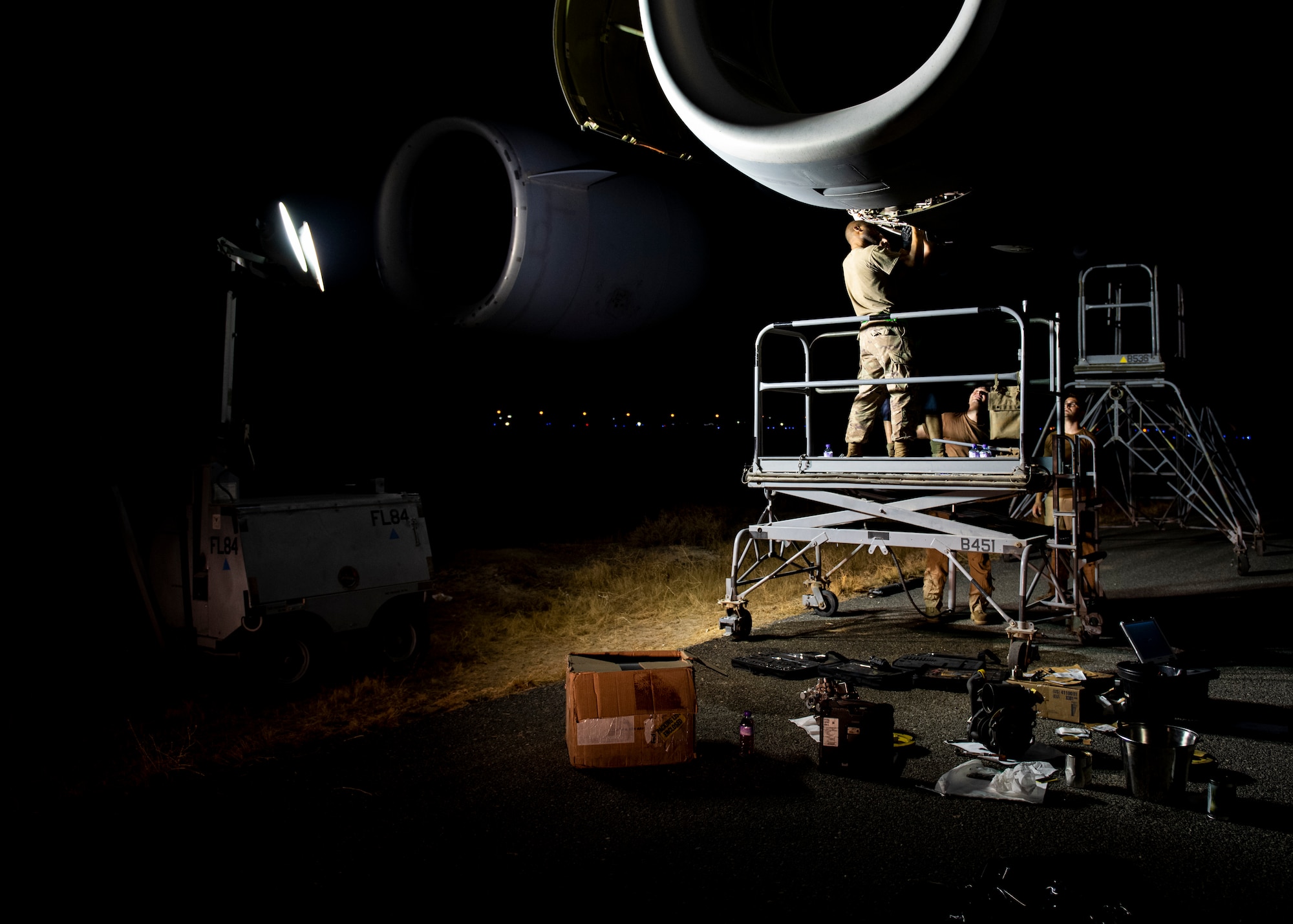 Tech. Sgt. Byron Hand, 5th Expeditionary Air Mobility Squadron aerospace propulsion craftsman, works on a Canadian C-17A Globemaster III engine.