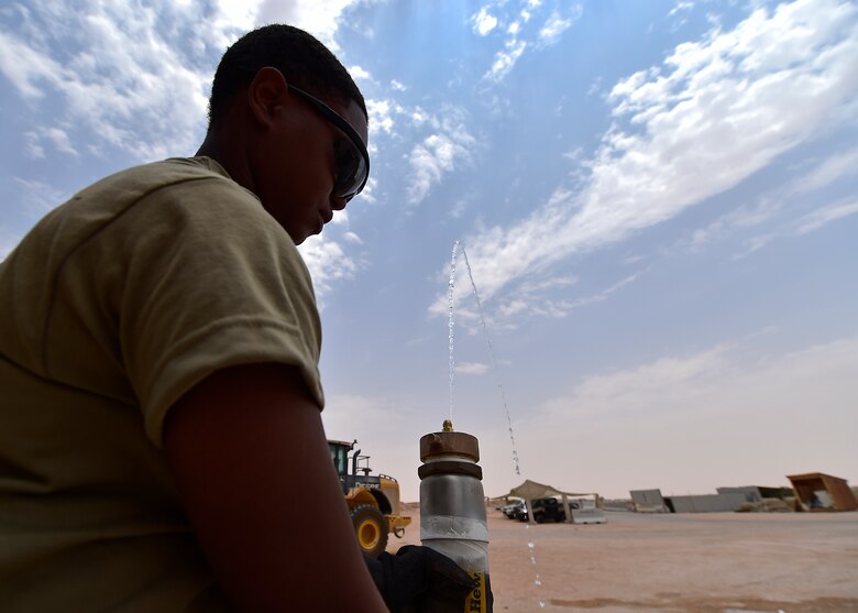 Airmen from the 378th Expeditionary Logisitcs Readiness Squadron perform a hydrostatic test on fuel hoses at Prince Sultan Air Base, Kingdom of Saudi Arabia.