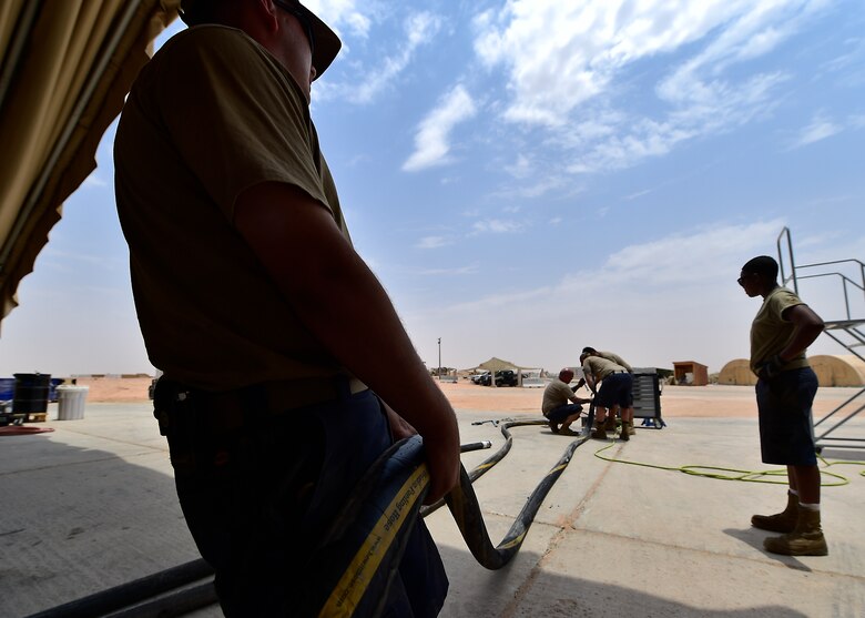 Airmen from the 378th Expeditionary Logisitcs Readiness Squadron perform a hydrostatic test on fuel hoses at Prince Sultan Air Base, Kingdom of Saudi Arabia.