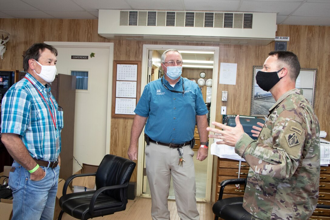 U.S. Army Corps of Engineers (USACE) Vicksburg District Commander Col. Robert Hilliard (right) speaks with River Operations employees Ed Adcock (center) and Barry Sullivan ahead of the Mat Sinking Unit's deployment July 21.