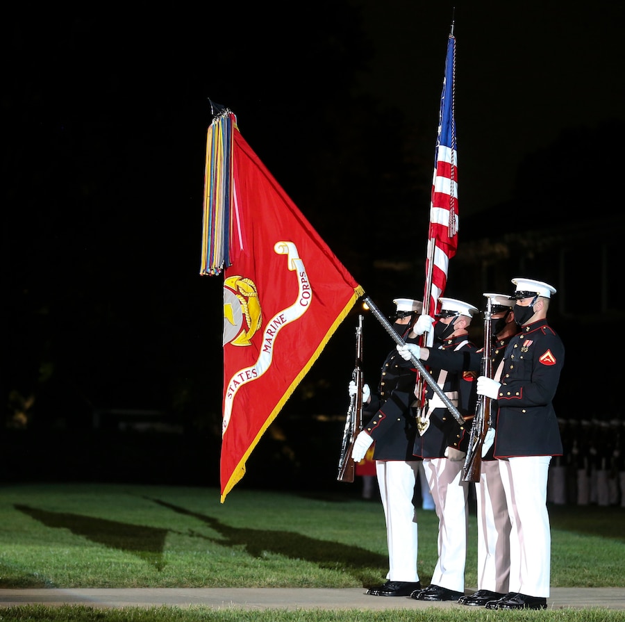 Marines with the official U.S. Marine Corps Color Guard present the National Ensign for the playing of our National Anthem during a Friday Evening Parade at Marine Barracks Washington, D.C. , July 31, 2020. The Honorable Mr. James F. Geurts, Assistant Secretary of the Navy for Research, Development & Acquisition (ASN (RD&A)), was the guest of honor, and the Assistant Commandant of the Marine Corps, Gen. Gary L. Thomas, was the hosting official for the evening. To effectively host Evening Parades, the Barracks follows Department of Defense guidelines and Centers for Disease Control and Prevention (CDC) recommendations. Additionally, we apply several of Washington D.C.’s safeguards to include: physical distancing for patrons, health screenings, and mandatory wear of protective equipment.