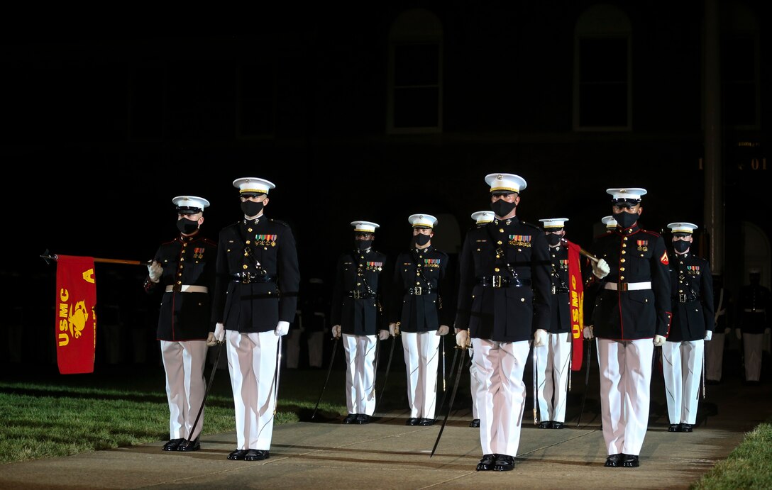 Marines with Alpha and Bravo Marching Companies, Marine Barracks Washington, D.C., conduct “officers center” during a Friday Evening Parade at the Barracks, July 31, 2020. The Honorable Mr. James F. Geurts, Assistant Secretary of the Navy for Research, Development & Acquisition (ASN (RD&A)), was the guest of honor, and the Assistant Commandant of the Marine Corps, Gen. Gary L. Thomas, was the hosting official for the evening. To effectively host Evening Parades, the Barracks follows Department of Defense guidelines and Centers for Disease Control and Prevention (CDC) recommendations. Additionally, we apply several of Washington D.C.’s safeguards to include: physical distancing for patrons, health screenings, and mandatory wear of protective equipment.