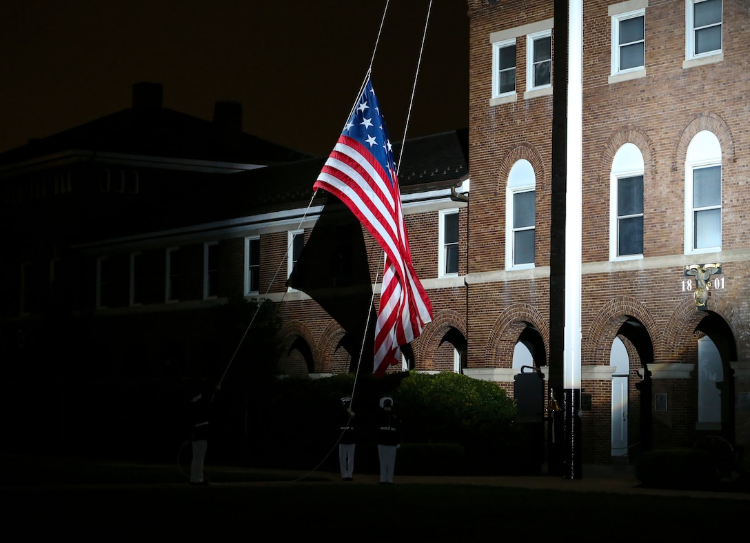A flag lowering detail with Marine Barracks Washington, D.C. conducts “Evening Colors” during a Friday Evening Parade at the Barracks, July 31, 2020. The Honorable Mr. James F. Geurts, Assistant Secretary of the Navy for Research, Development & Acquisition (ASN (RD&A)), was the guest of honor, and the Assistant Commandant of the Marine Corps, Gen. Gary L. Thomas, was the hosting official for the evening. To effectively host Evening Parades, the Barracks follows Department of Defense guidelines and Centers for Disease Control and Prevention (CDC) recommendations. Additionally, we apply several of Washington D.C.’s safeguards to include: physical distancing for patrons, health screenings, and mandatory wear of protective equipment.