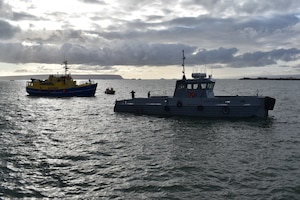 Air Force tugboat, “Rising Star,” tows a rescued commercial ship into the harbor at Thule Air Base, Greenland, Monday, Aug. 3. “The rapid efforts and teamwork of the 821st Air Base Group, Vectrus Services, the Royal Danish Air Force, Joint Arctic Command and the Joint Rescue Coordination Center were instrumental in saving lives today,” said Col. David Hanson, Thule AB installation commander. (U.S. Air Force photo by Lt. Col. Christopher Iavarone)