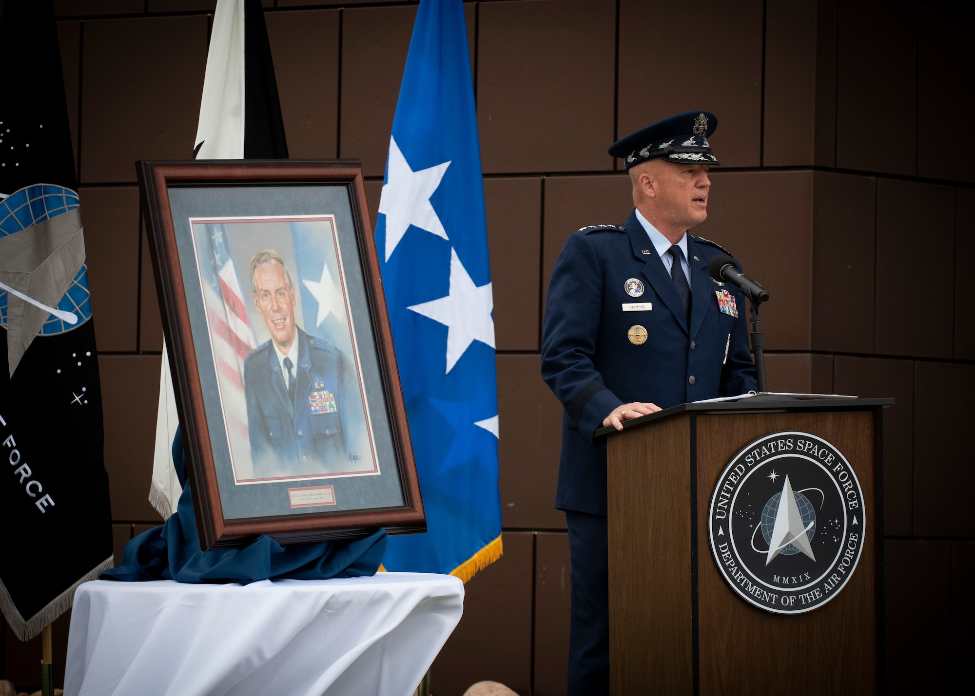 Gen. John W. “Jay” Raymond, U.S. Space Force Chief of Space Operations and Commander, U.S. Space Command, addresses attendees during the Gen. Moorman Tribute ceremony at the Moorman Education and Training Center at Peterson Air Force Base, Colorado, Aug. 3, 2020.