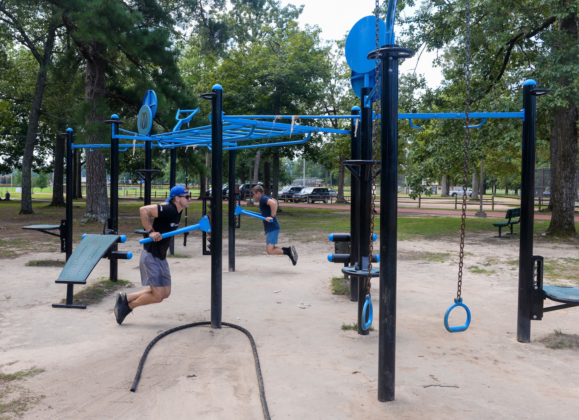 Second Lt. Danny Highland and 2nd Lt. Maxwell Heefner, both 41st Flying Training Squadron student pilots, conduct body dips at Freedom Park on August 8, 2020, at Columbus Air Force Base, Miss. Although the Columbus Air Force Base gym may be open, it is only available to active duty members while the base is operating under HPCON Charlie. (U.S. Air Force photo by Airman 1st Class Davis Donaldson)