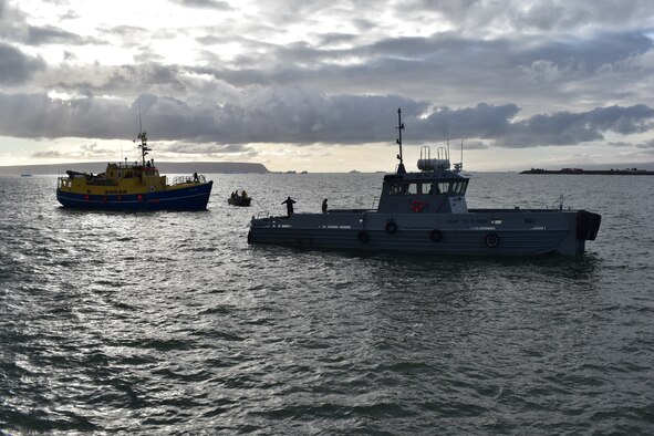 Air Force tugboat, “Rising Star,” tows a rescued commercial ship into the harbor at Thule Air Base, Greenland, Monday, Aug. 3. “The rapid efforts and teamwork of the 821st Air Base Group, Vectrus Services, the Royal Danish Air Force, Joint Arctic Command and the Joint Rescue Coordination Center were instrumental in saving lives today,” said Col. David Hanson, Thule AB installation commander. (U.S. Air Force photo by Lt. Col. Christopher Iavarone)