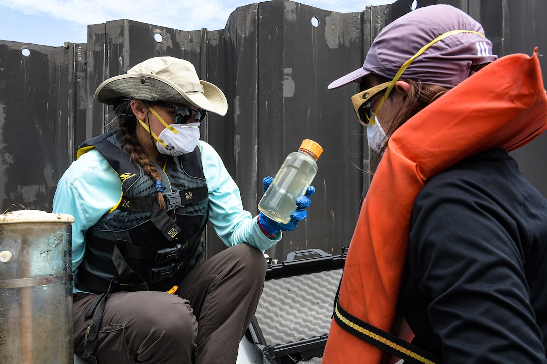 Engineering Research and Development Center employees, Angela Urban, a research community planner and Marissa Campobasso, an environmental engineer, collects blue-green algae samples and data on Lake Okeechobee, Fla., July 27, 2020.