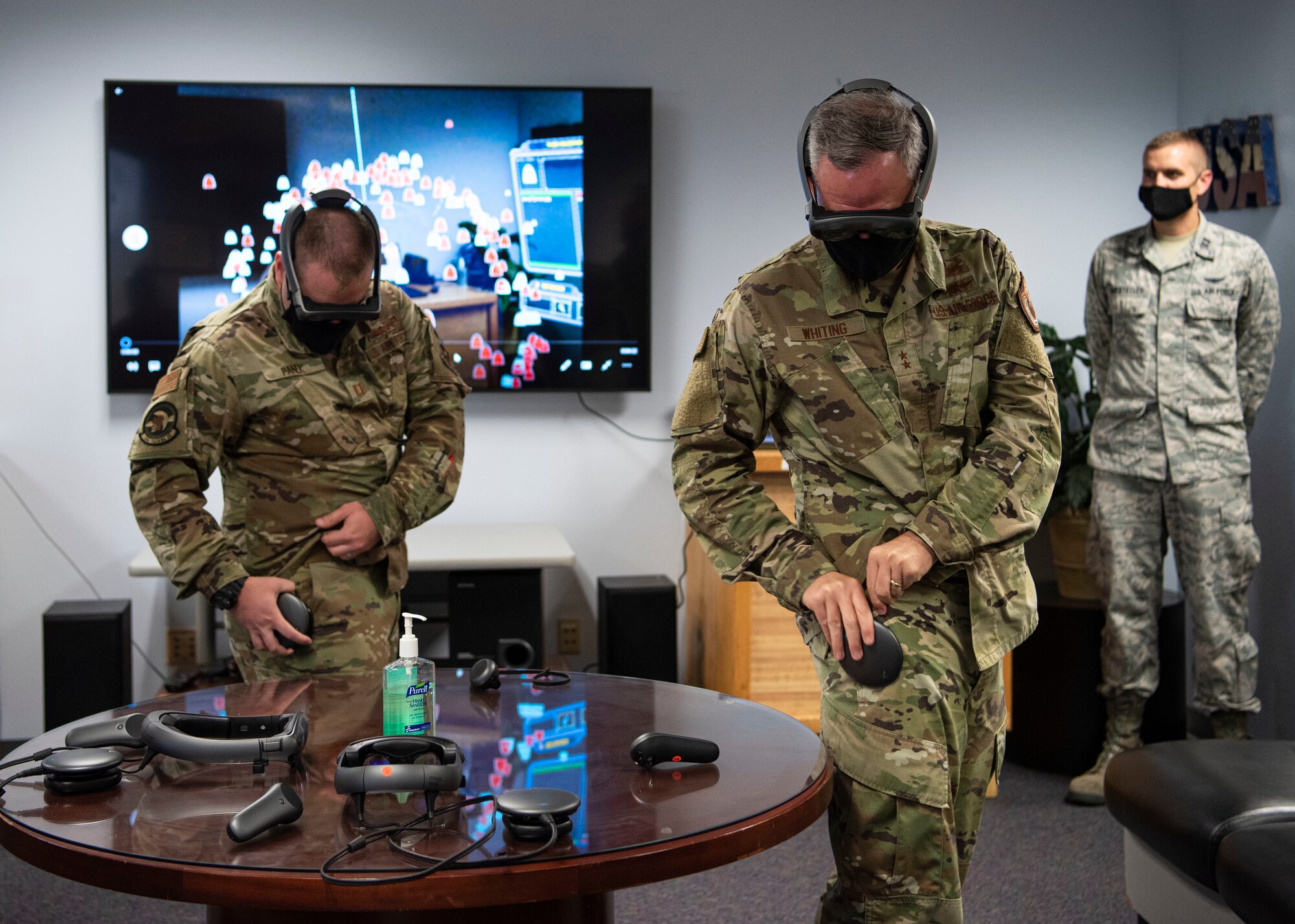 Capt. Alexander Panek, 533rd Training Squadron assistant flight commander, shows Maj. Gen. Stephan Whiting, United States Space Force deputy commander, how to use new virtual training equipment at the 533rd TRS, Vandenberg Air Force Base, Calif., July 29, 2020. During the visit, Whiting visited various units and learned about new developments for the 30th Space Wing, Combined Force Space Component Command, and 381st Training Group at Vandenberg AFB. (U.S. Air Force photo by Senior Airman Aubree Owens)