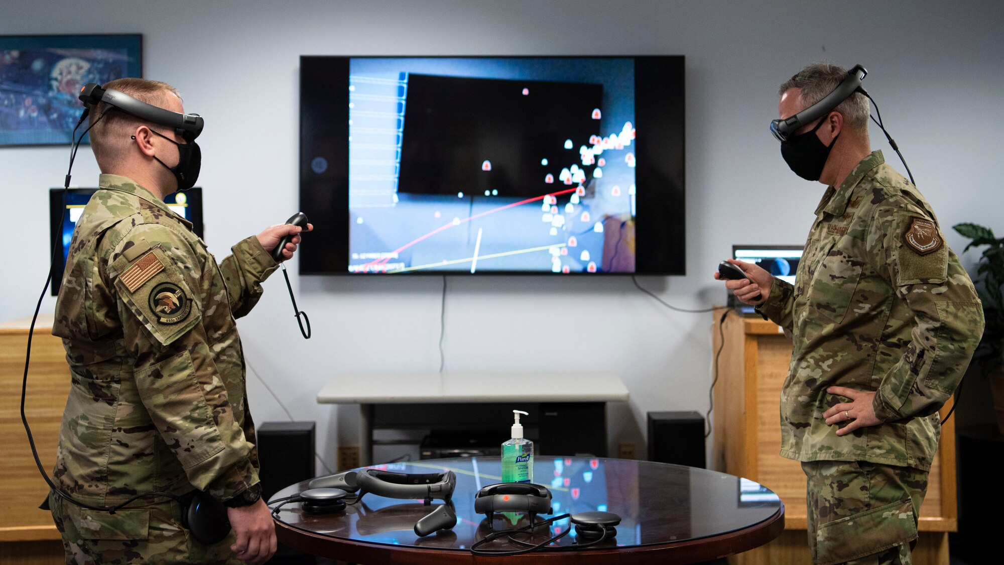 Capt. Alexander Panek, 533rd Training Squadron assistant flight commander, shows Maj. Gen. Stephan Whiting, United States Space Force deputy commander, how to use new virtual training equipment at the 533rd TRS, Vandenberg Air Force Base, Calif., July 29, 2020. During the visit, Whiting visited various units and learned about new developments for the 30th Space Wing, Combined Force Space Component Command, and 381st Training Group at Vandenberg AFB. (U.S. Air Force photo by Senior Airman Aubree Owens)