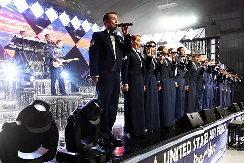 Tops in Blue closes out the show with a rendition of the Air Force song while in their mess dress, Oct. 10, 2015, at Seymour Johnson Air Force Base, Tops in Blue closes out the show with a rendition of the Air Force song while in their mess dress, Oct. 10, 2015, at Seymour Johnson Air Force Base, North Carolina.