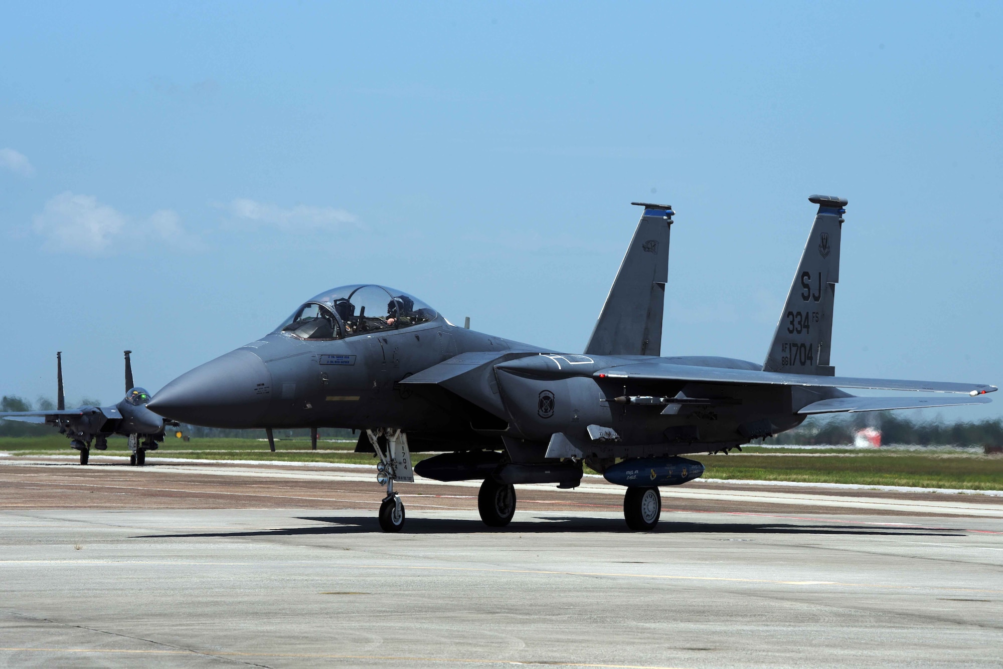 An F-15E taxis after landing on the runway.