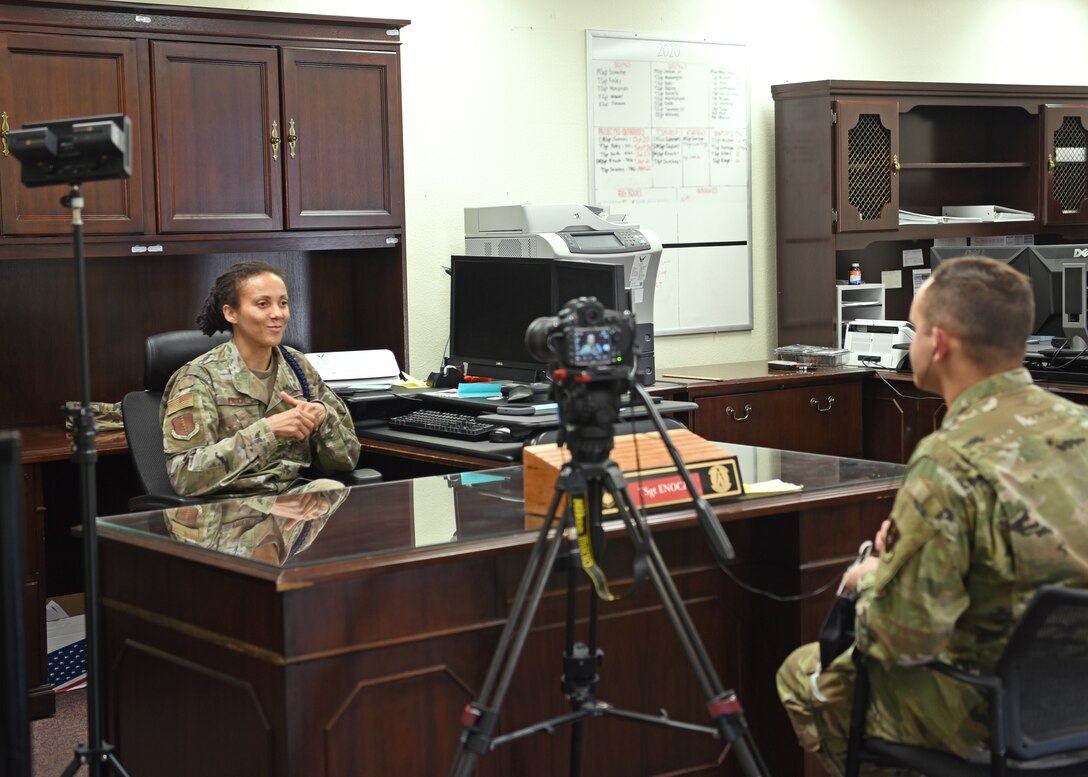 U.S. Air Force Tech. Sgt. Latosha Enoch, 17th Training Support Squadron military training flight chief, expresses her thoughts during an interview with Senior Airman Deven Schultz, 17th Training Wing Public Affairs broadcast journalist, while maintaining a social distance, in the Military Training building, on Goodfellow Air Force Base, Texas, Aug. 4, 2020. Enoch discussed how MTLs have responded to the challenges of COVID-19.  (U.S. Air Force photo by Airman 1st Class Abbey Rieves)