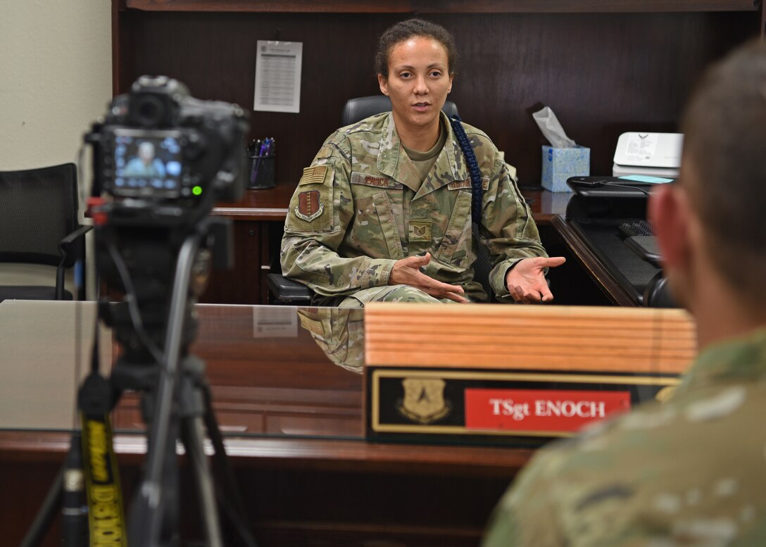 The camera of U.S. Air Force Senior Airman Deven Schultz, 17th Training Wing Public Affairs broadcast journalist records an interview with Tech. Sgt. Latosha Enoch, 17th Training Support Squadron military training flight chief, in the Military Training building, on Goodfellow Air Force Base, Texas, Aug. 4, 2020. Schultz collected historical documentation of how the different units around base responded to COVID-19. (U.S. Air Force photo by Airman 1st Class Abbey Rieves)