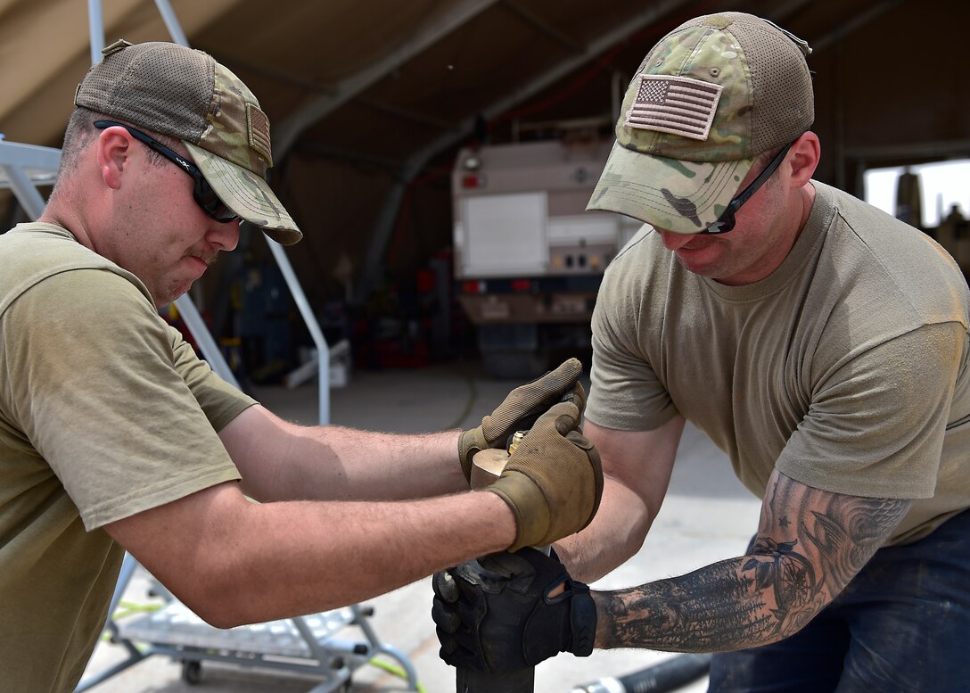 Airmen from the 378th Expeditionary Logisitcs Readiness Squadron perform a hydrostatic test on fuel hoses at Prince Sultan Air Base, Kingdom of Saudi Arabia.
