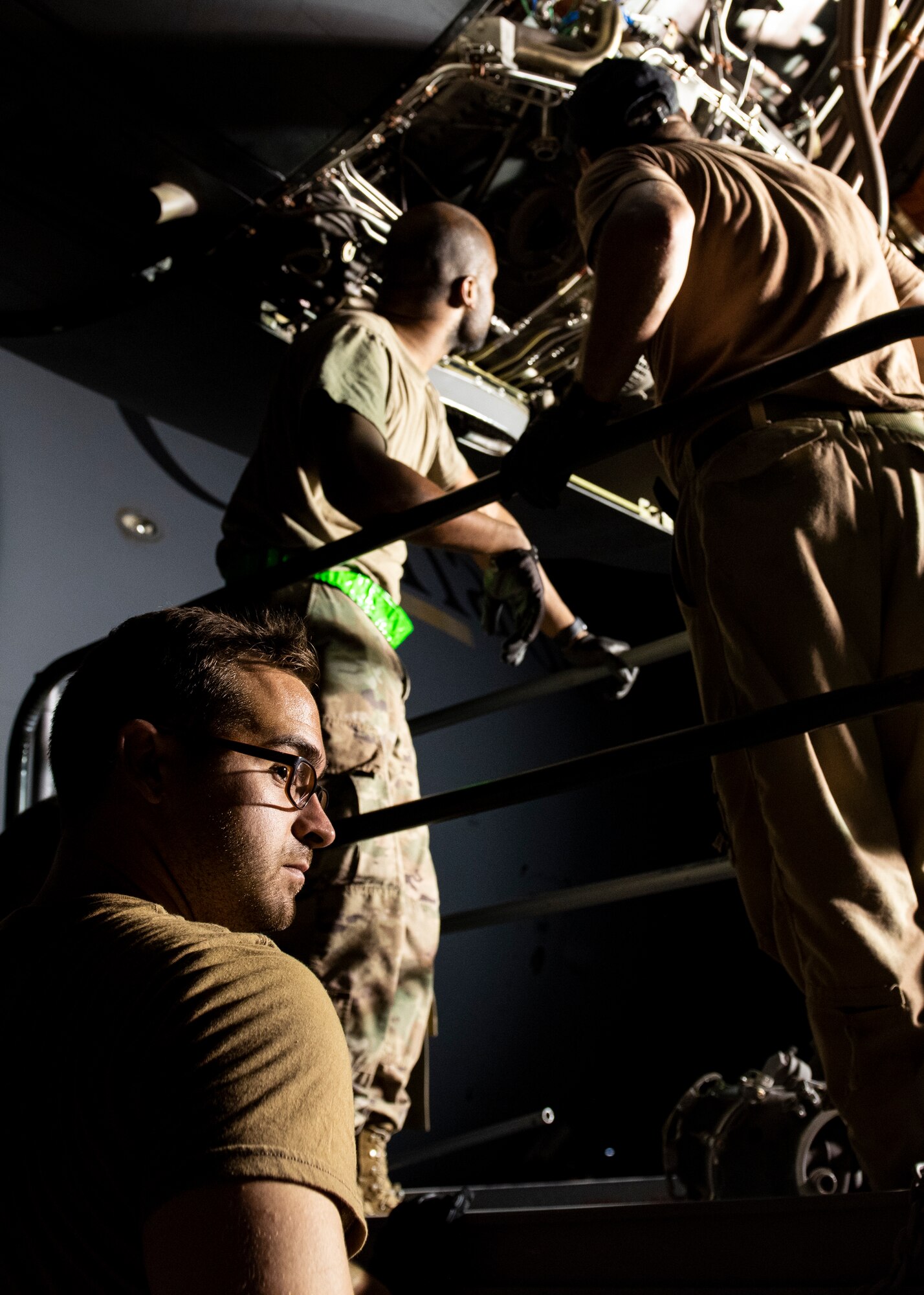 Canadian Cpl. Josh Beaudoin-Casavant, 429 Squadron avionics system technician, looks into the distance during an engine repair.