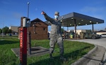 Staff Sgt. Justin Ratcliffe,  an NCO in charge of fuels fixed facilities with the 509th Logistics Readiness Squadron, points to safety valves and introduces students to safety measures and procedures at a government vehicle fuel station at Whiteman Air Force Base, Missouri, July 22, 2020. The introduction to the station and its fuel spill mitigation measures was part of a Defense Logistics Agency and 509th Civil Engineer Squadron  spill response and mitigation course. (U.S. Air Force photo by Tech. Sgt. Alexander W. Riedel)