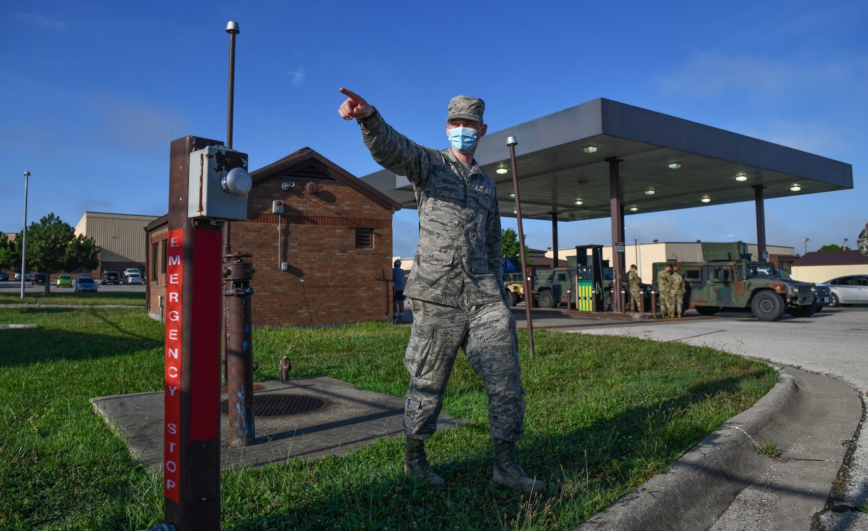 Staff Sgt. Justin Ratcliffe,  an NCO in charge of fuels fixed facilities with the 509th Logistics Readiness Squadron, points to safety valves and introduces students to safety measures and procedures at a government vehicle fuel station at Whiteman Air Force Base, Missouri, July 22, 2020. The introduction to the station and its fuel spill mitigation measures was part of a Defense Logistics Agency and 509th Civil Engineer Squadron  spill response and mitigation course. (U.S. Air Force photo by Tech. Sgt. Alexander W. Riedel)