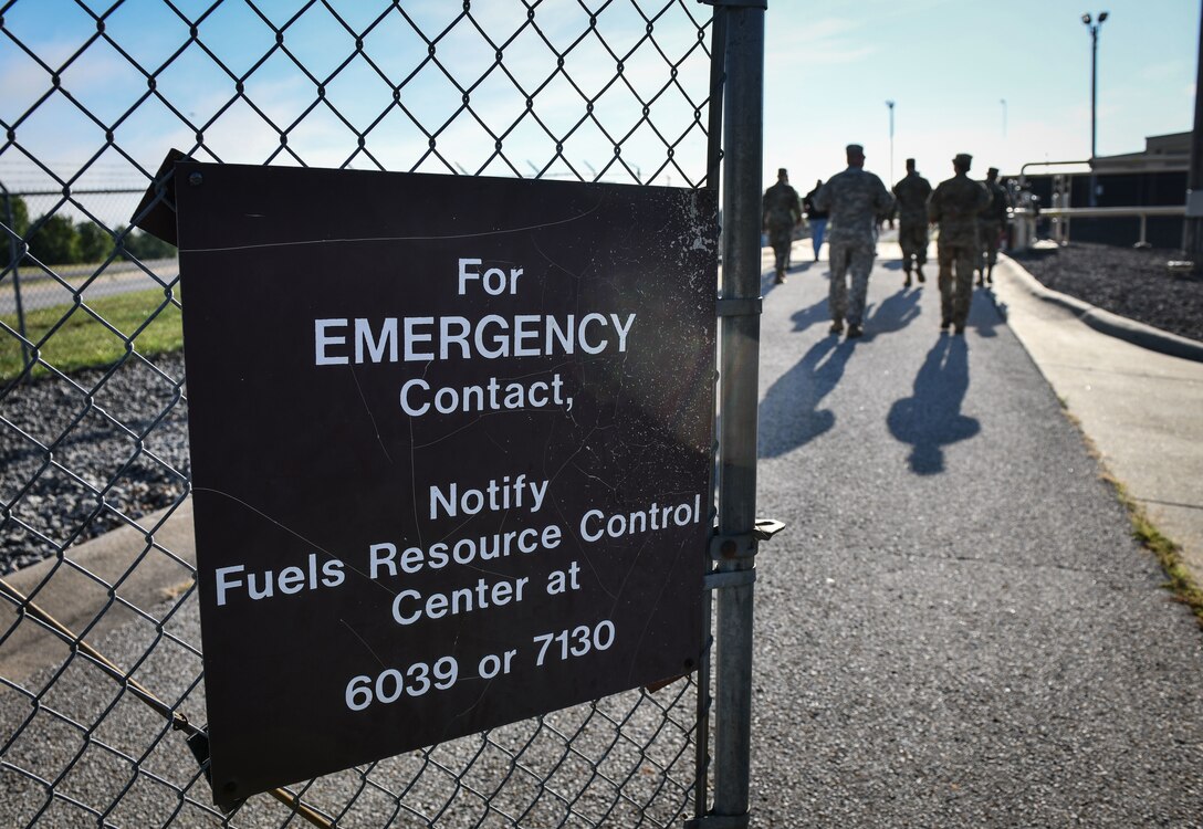 Students of a spill response course walk into a fuel storage and distribution facility July 22, 2020, at Whiteman Air Force Base, Missouri. Conducted in cooperation between the Defense Logistics Agency, 509th Civil Engineer Squadron and 509th Logistics Readiness Squadron, the course reviewed important spill mitigation and prevention actions and introduced attendees to fuel handling protocols and safety measures at Whiteman AFB. (U.S. Air Force photo by Tech. Sgt. Alexander W. Riedel)