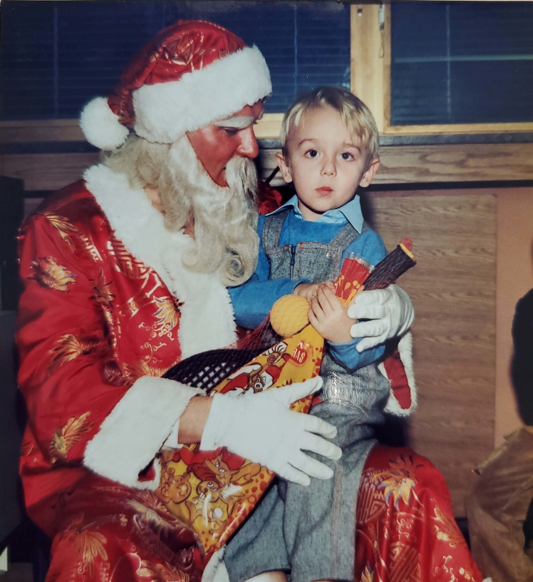 Tech. Sgt. Muris Secerbegovic, 433rd Maintenance Group quality assurance inspector, as a child with Santa Claus in Banja Luka, Bosnia-Herzigovina.