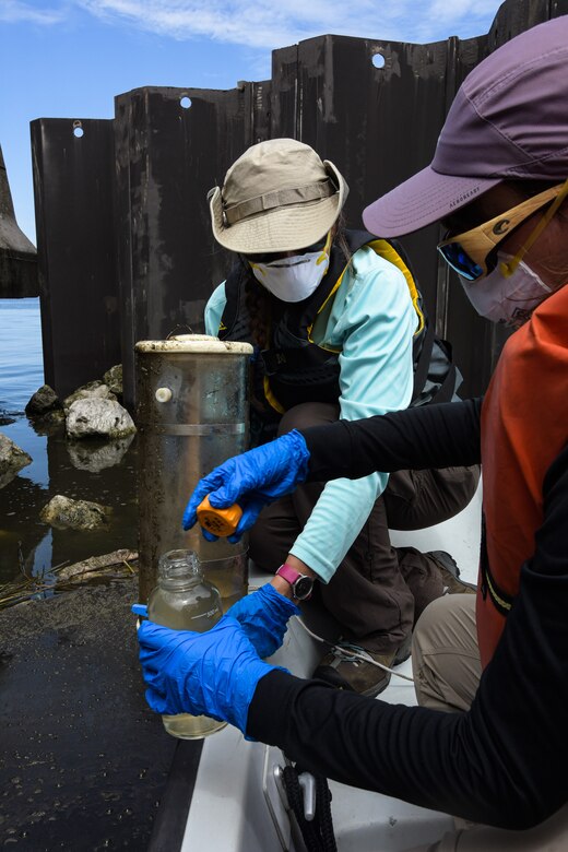 Engineering Research and Development Center employees, Angela Urban, a research community planner and Marissa Campobasso, an environmental engineer, collects blue-green algae samples and data on Lake Okeechobee, Fla., July 27, 2020.