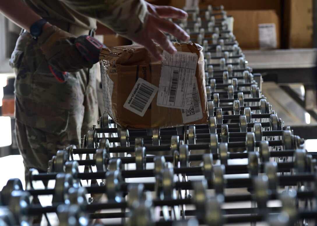 Airmen from the 378th Expeditionary Force Support Squadron receive packages at Prince Sultan Air Base, Kingdom of Saudi Arabia.