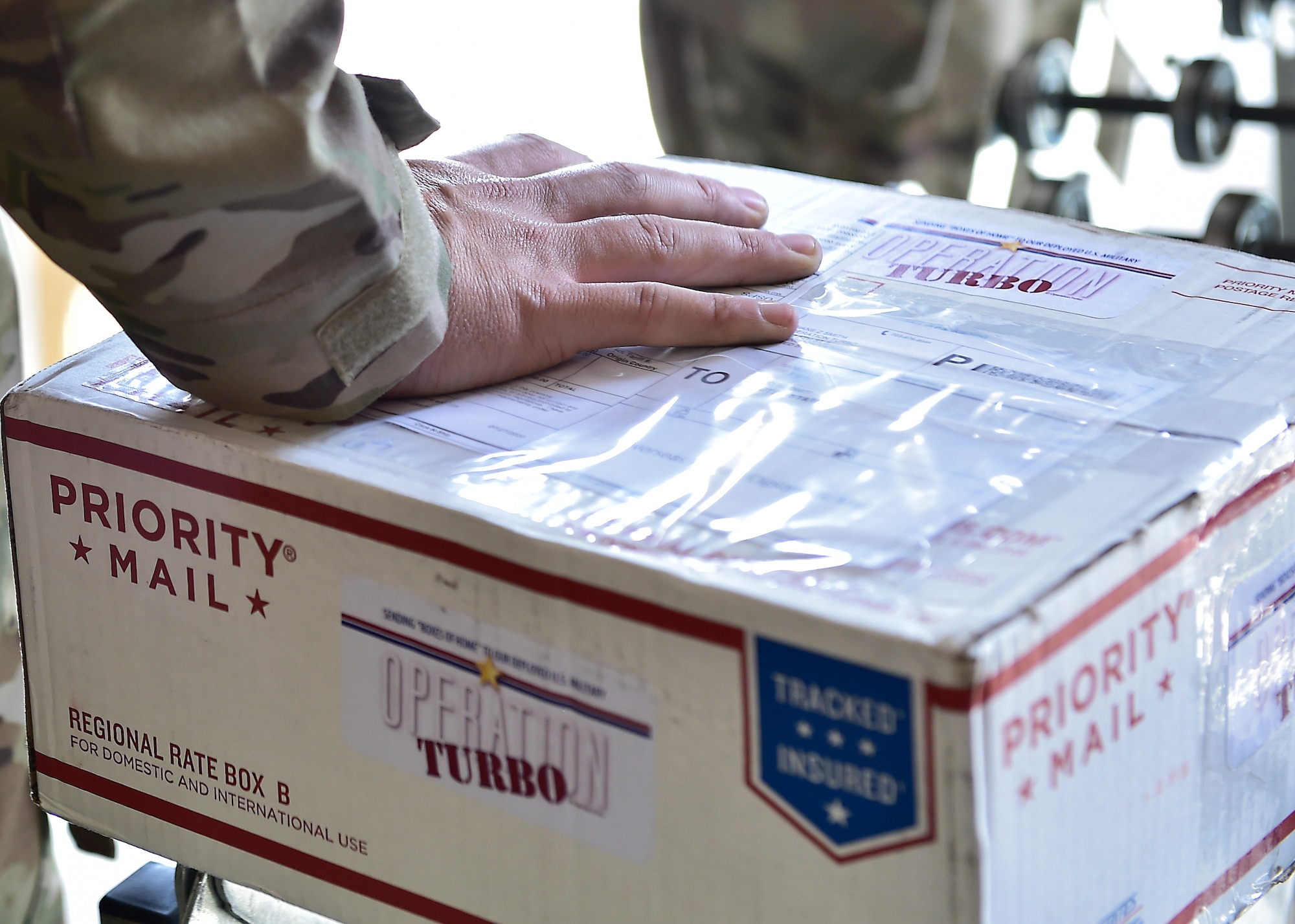 Airmen from the 378th Expeditionary Force Support Squadron receive packages at Prince Sultan Air Base, Kingdom of Saudi Arabia.