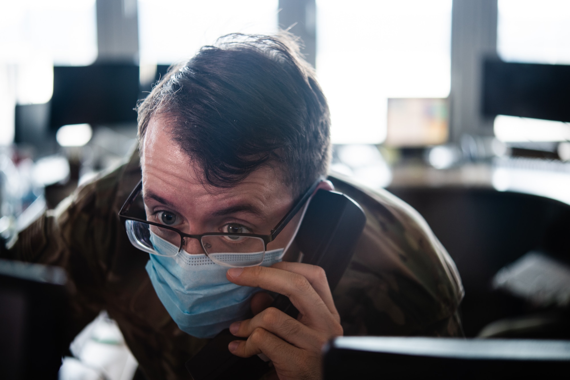 Photo of Airman talking on a phone