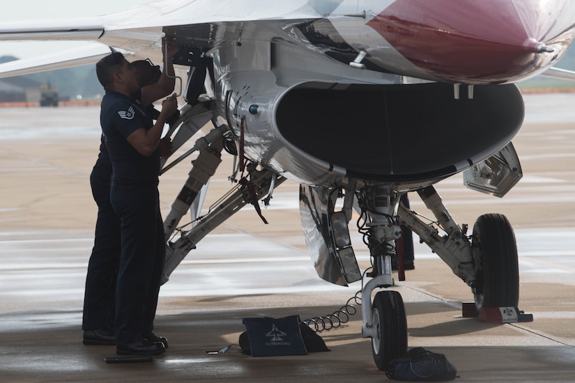 U.S. Air Force Thunderbird members perform post-flight checks and maintenance on the aircraft after arriving at Joint Base Langley-Eustis, Virginia, Aug. 5, 2020.
