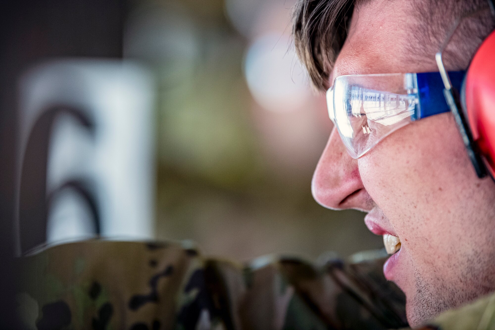 U.S. Air Force Senior Airman Michael Pritchard, 423rd Security Forces Squadron (SFS) patrolman, fires an M18 handgun during a qualification course, at RAF Molesworth, England, July 28, 2020. During the course, Airmen from the 423rd SFS became familiar with the M18 and learned about its various functions and overall benefits such as improved ergonomics, target acquisition, reliability and durability to increase shooter lethality. The M18 Sig Sauer Modular Handgun System will be replacing the M9 Beretta which has been in use for over 30 years. (U.S. Air Force photo by Senior Airman Eugene Oliver)