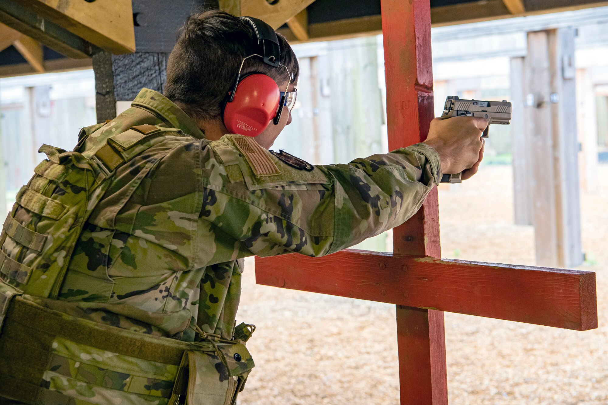 U.S. Air Force Senior Airman Michael Pritchard, 423rd Security Forces Squadron (SFS) patrolman, fires an M18 handgun during a qualification course, at RAF Molesworth, England, July 28, 2020. During the course, five Airmen from the 423rd SFS were introduced to the M18 SIG Sauer Modular Handgun System and were able to learn about its various functions and internal components. The M18 will be replacing the M9 Beretta, which has been in use by security forces for over 30 years. (U.S. Air Force photo by Senior Airman Eugene Oliver)