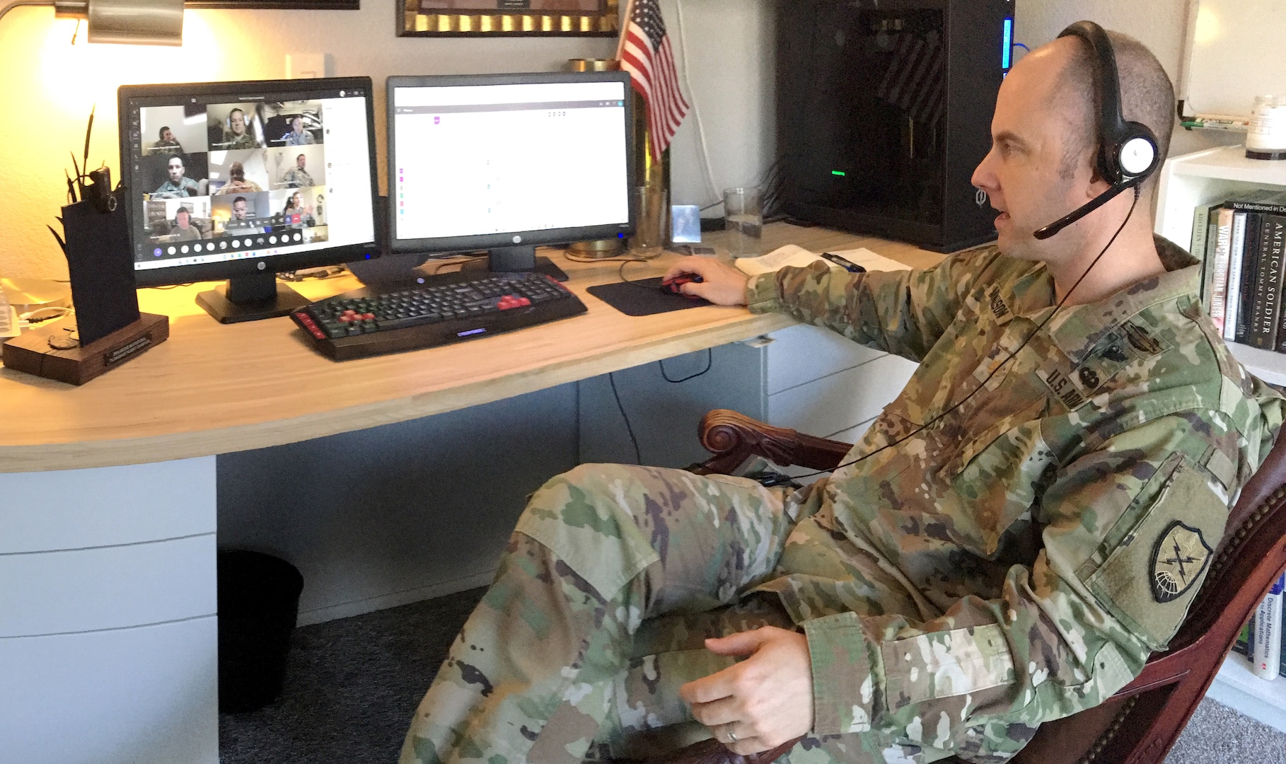 U.S. Army Maj. Mikael Magnuson, commander of Cyber Protection Team 171, discusses drill details with personnel in his unit, June 25, 2020. Due to COVID-19 and social distancing, Magnuson conducted the unit's first virtual inactive duty training from his home in Rocklin, California.
