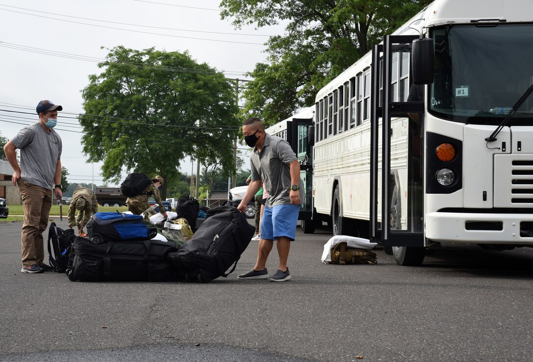 Photo of students offloading bags