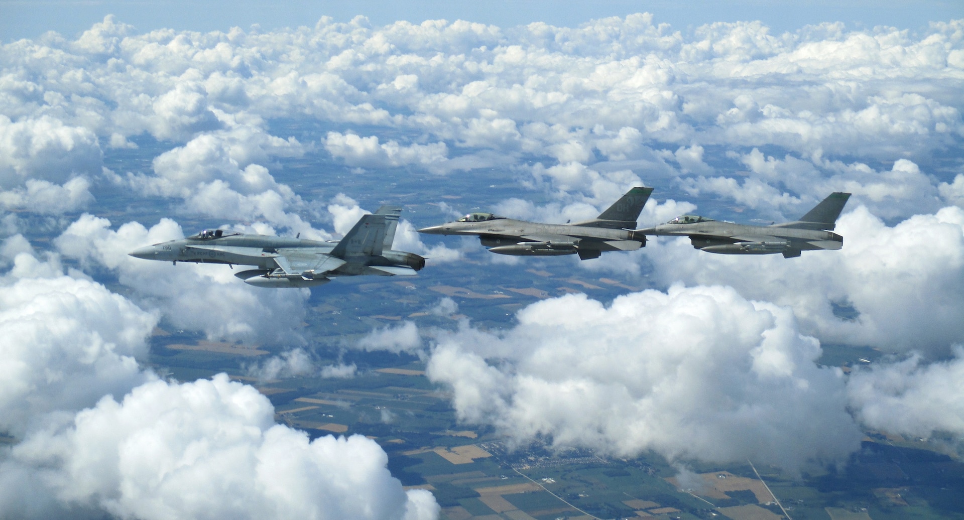 Royal Canadian Air Force CF-18 and United States Air Force F-16s participate in binational NORAD air defence exercise conducted over the Greater Toronto Area on July 30, 2020.(Photo courtesy of CANR Public Affairs)