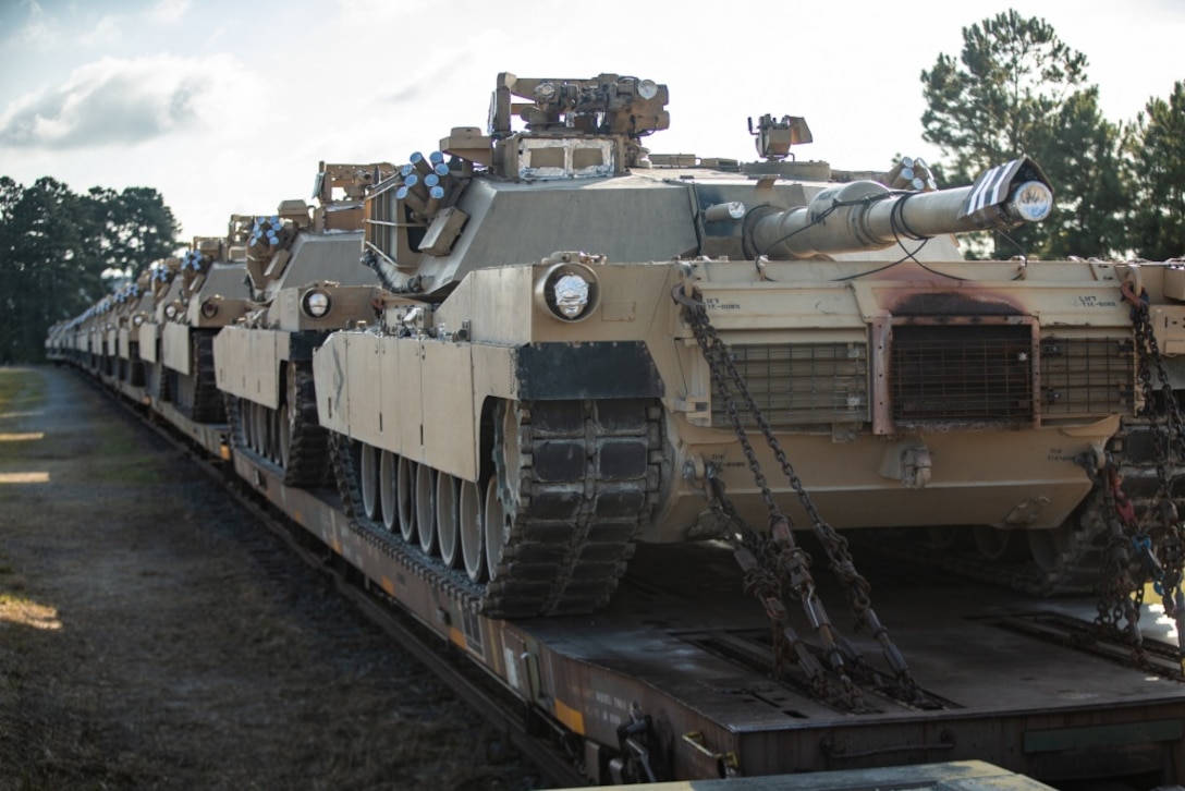 U.S. Marine Corps M1A1 Abrams tanks with 2d Tank Battalion, 2d Marine Division (MARDIV) sit on railroad cars prior to a farewell ceremony on Camp Lejeune, North Carolina, July 31, 2020. Marines with 2d Tank Battalion bid their final farewell after nearly 80 years of service to 2d MARDIV in accordance to the future redesign of the Marine Corps. (U.S. Marine Corps photo by Lance Cpl. Patrick King)