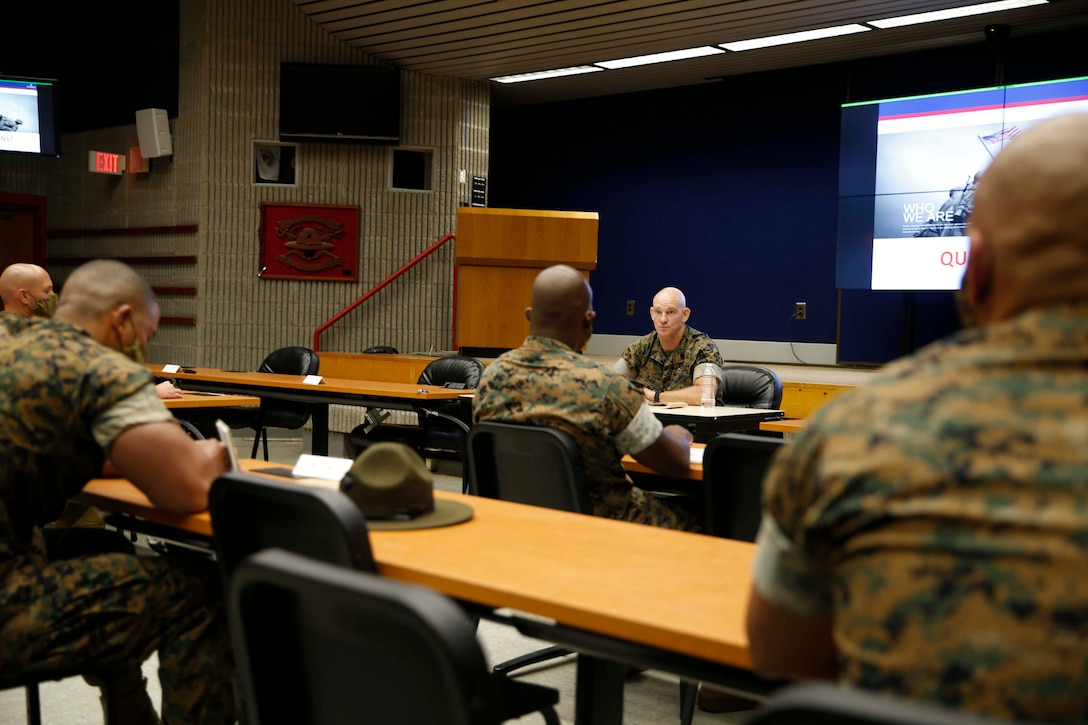 The 19th Sergeant Major of the Marine Corps, Sgt. Maj. Troy E. Black sits in a command brief at the Drill Instructor School at Marine Corps Recruit Depot (MCRD) Parris Island, South Carolina, July 22, 2020. During the visit Sgt. Maj. Black toured the training facilities to observe changes made keep recruits and Drill Instructors safe during COVID-19 restrictions. The changes include the use of face masks when less than six feet apart, and smaller platoon sizes in addition to the 14 days of restriction of movement before new recruits start training. (U.S. Marine Corps photo by Sgt. Victoria Ross)