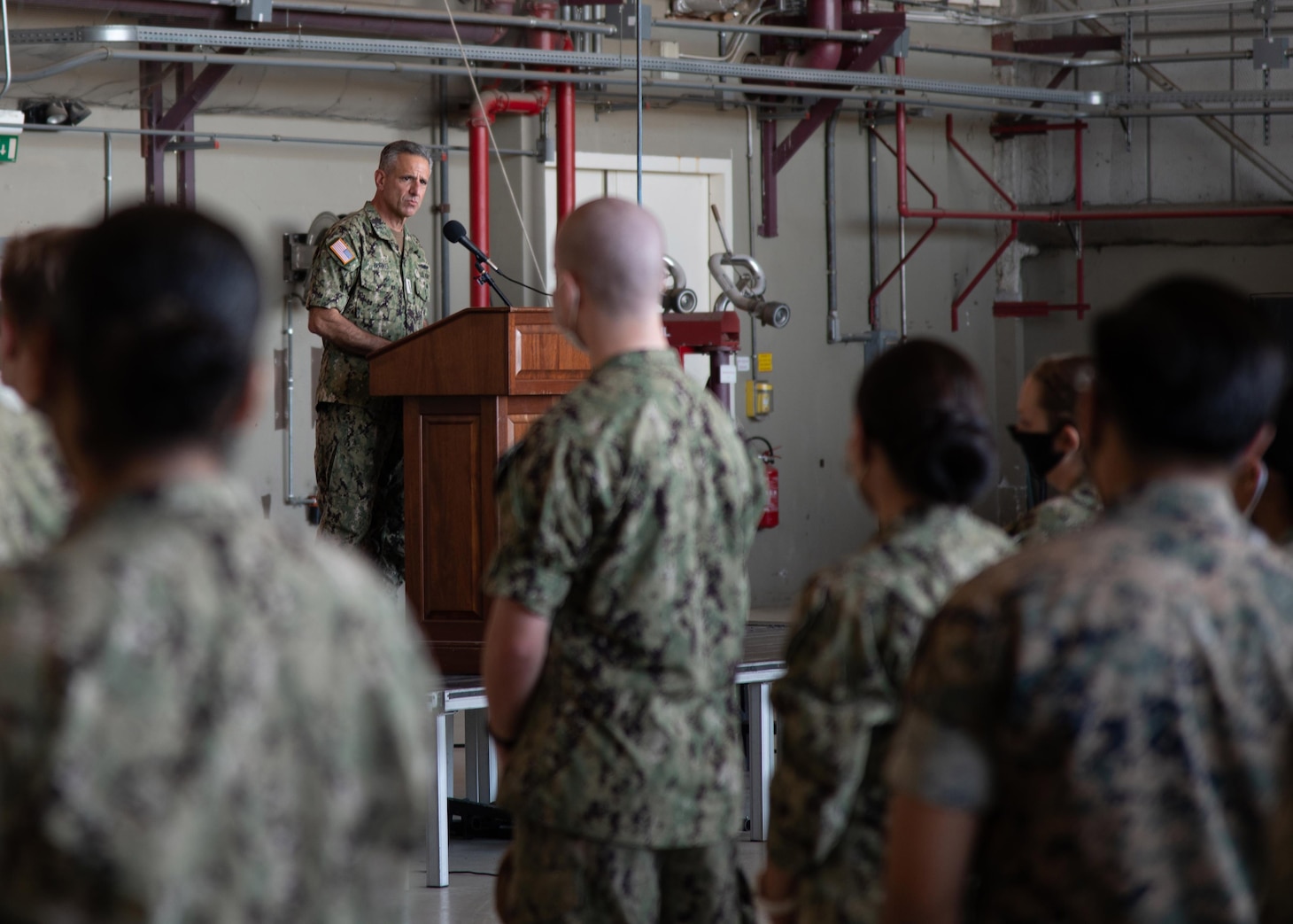 Adm. Robert P. Burke, commander, U.S. Naval Forces Europe-Africa (CNE-CNA) and commander, Allied Joint Forces Command (JFC) Naples, right, and CNE-CNA Fleet Master Chief Derrick Walters hold an all hands call with Sailors and Marines onboard Naval Air Station Sigonella during a base familiarization tour, Aug. 6, 2020.