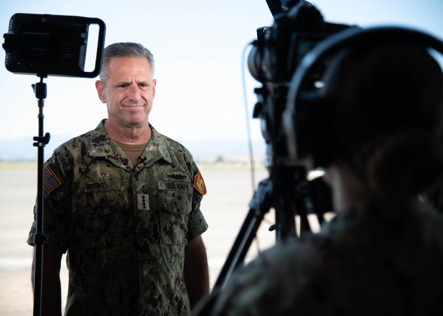 Adm. Robert P. Burke, commander, U.S. Naval Forces Europe-Africa (CNE-CNA) and commander, Allied Joint Forces Command (JFC) Naples, right, and CNE-CNA Fleet Master Chief Derrick Walters hold an all hands call with Sailors and Marines onboard Naval Air Station Sigonella during a base familiarization tour, Aug. 6, 2020.