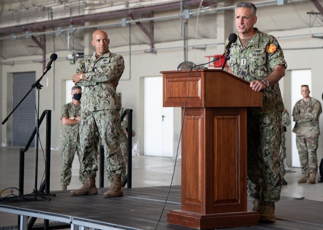 Adm. Robert P. Burke, commander, U.S. Naval Forces Europe-Africa (CNE-CNA) and commander, Allied Joint Forces Command (JFC) Naples, right, and CNE-CNA Fleet Master Chief Derrick Walters hold an all hands call with Sailors and Marines onboard Naval Air Station Sigonella during a base familiarization tour, Aug. 6, 2020.