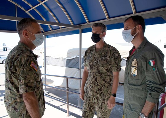 Adm. Robert P. Burke, commander, U.S. Naval Forces Europe-Africa (CNE-CNA) and commander, Allied Joint Forces Command (JFC) Naples, right, and CNE-CNA Fleet Master Chief Derrick Walters hold an all hands call with Sailors and Marines onboard Naval Air Station Sigonella during a base familiarization tour, Aug. 6, 2020.