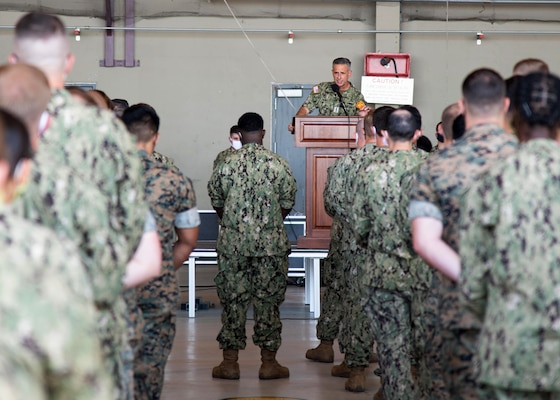 Adm. Robert P. Burke, commander, U.S. Naval Forces Europe-Africa (CNE-CNA) and commander, Allied Joint Forces Command (JFC) Naples, right, and CNE-CNA Fleet Master Chief Derrick Walters hold an all hands call with Sailors and Marines onboard Naval Air Station Sigonella during a base familiarization tour, Aug. 6, 2020.