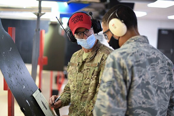 Airman First Class Gabriella Waple, a medical lab specialist from the 910th Medical Squadron, awaits the order to approach her weapon, August 1, 2020, Youngstown Air Reserve Station’s Combat Arms Training and Maintenance firing range. Sixteen medical professionals fired 100 rounds down range during their refresher training.