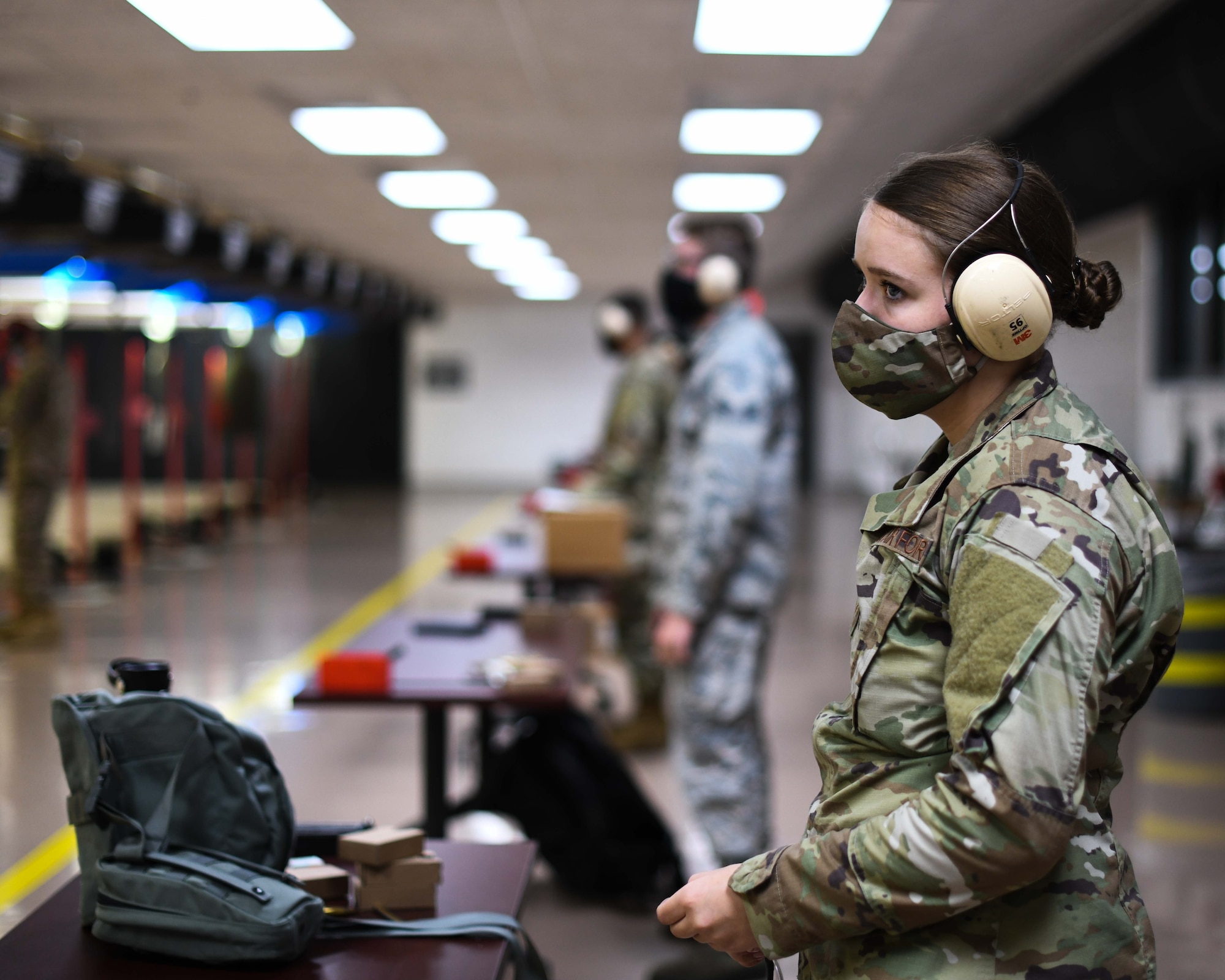 Airman First Class Gabriella Waple, a medical lab specialist from the 910th Medical Squadron, awaits the order to approach her weapon, August 1, 2020, Youngstown Air Reserve Station’s Combat Arms Training and Maintenance firing range. Sixteen medical professionals fired 100 rounds down range during their refresher training.