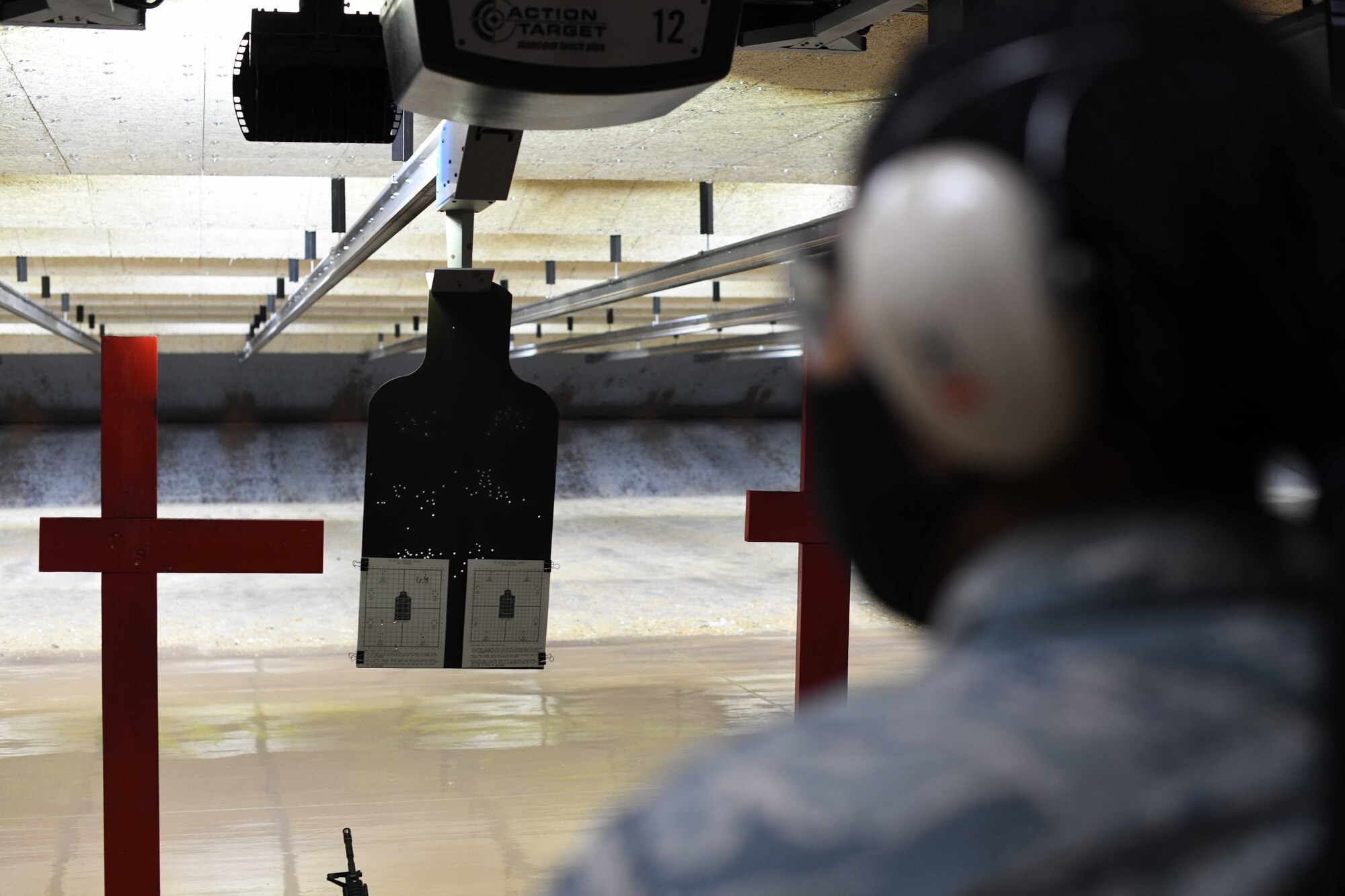 Airman First Class Jamier Willis, an aerospace medical service specialist from the 910th Medical Squadron, waits for her target to be racked and the order to approach her weapon, August 1, 2020, Youngstown Air Reserve Station’s Combat Arms Training and Maintenance firing range. Medical professionals are required to attend combat arms refresher training every 36 months.
