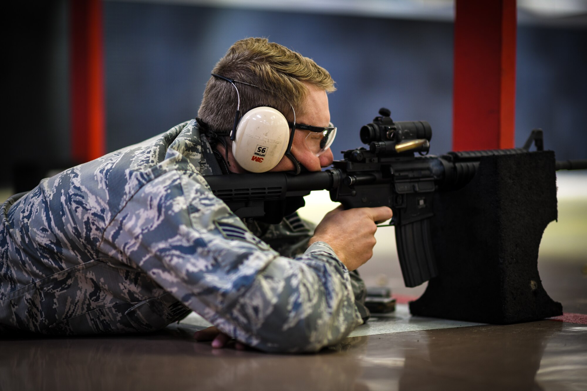 Senior Airman Brandon Martinez, a biomedical equipment specialist with the 910th Medical Squadron, shoots an M-4 carbine downrange at the Combat Arms Training and Maintenance firing range, August 1, 2020, Youngstown Air Reserve Station, Ohio. Medical professionals are required to qualify in combat arms every 36 months to remain mission ready.