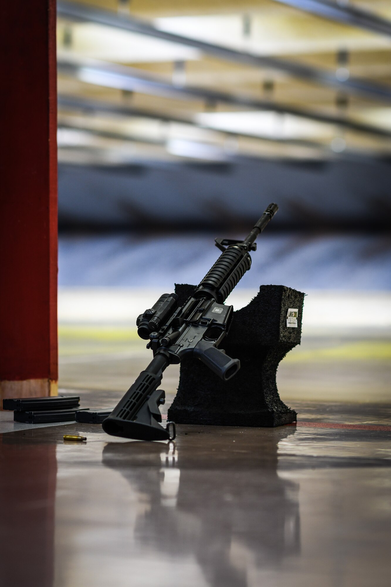 An M-4 carbine rifle leans up against a Sight-Bloc at the Combat Arms Training and Maintenance firing range, August 1, 2020, Youngstown Air Reserve Station, Ohio. The 910th Medical Squadron spent the day qualifying in combat arms, they are required to qualify every 36 months in order to remain mission ready.