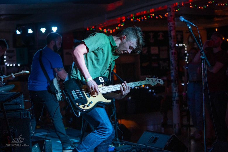 The band East 9th plays a set during the Fiction Forest Festival, July 13, 2019, Westside Bowl, Youngstown, Ohio. The photo was taken by Airman Chris Corso, a multimedia specialist assigned to the 910th Airlift Wing’s Public Affairs Office. Out of uniform Corso is an aspiring concert photographer managing his own website Chris Corso Media. His logo can be seen on the lower left of the photograph.