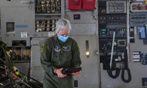 Master Sgt. Katherine Whaley, 144th Airlift Squadron loadmaster, looks through a checklist while loading a Joint Base Charleston C-17 Globemaster III for launch July 31st, 2020 at the JB Charleston flightline, S.C. C-17s from JB Charleston are a part of the NASA human space flight program. As a precautionary measure, U.S. Space Command and the U.S. Air Force assigned teams of search and rescue professionals to stand alert ahead of the launch at Joint Base Charleston, South Carolina; Patrick Air Force Base, Florida; and Joint Base Pearl Harbor-Hickam, Hawaii. The teams are comprised of Pararescuemen, Combat Rescue Officers, and Aircrew Flight Equipment specialists.