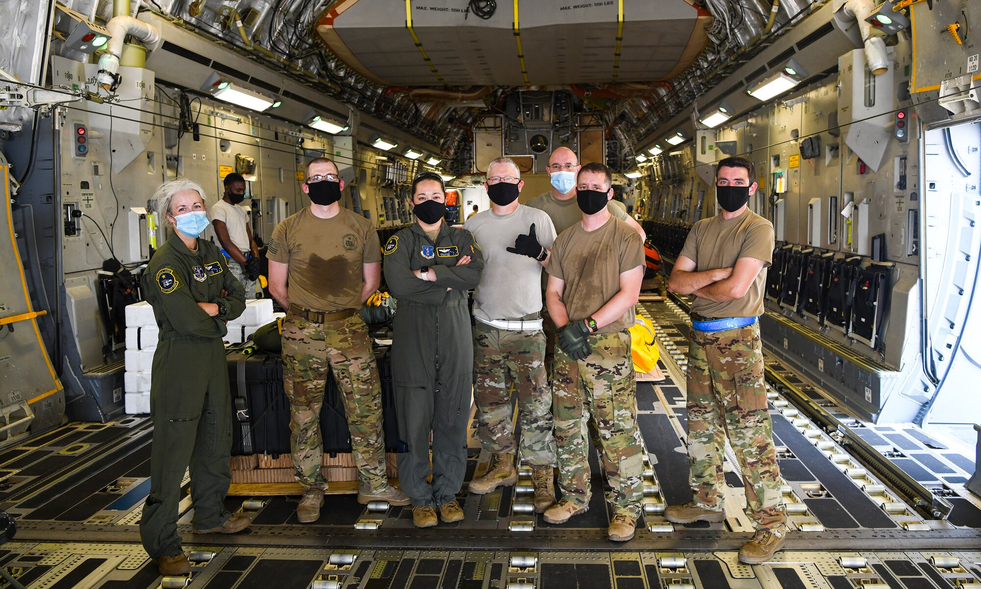 Airmen who are part of the NASA human space flight loadmaster team assigned to the 144th Airlift Squadron, Joint Base Elmendorf-Richardson, Alaska pose for a photo after loading a Joint Base Charleston C-17 Globemaster III for launch July 31st, 2020 at the JB Charleston flightline, S.C. C-17s from JB Charleston are a part of the NASA human space flight program. As a precautionary measure, U.S. Space Command and the U.S. Air Force assigned teams of search and rescue professionals to stand alert ahead of the launch at Joint Base Charleston, South Carolina; Patrick Air Force Base, Florida; and Joint Base Pearl Harbor-Hickam, Hawaii. The teams are comprised of Pararescuemen, Combat Rescue Officers, and Aircrew Flight Equipment specialists.