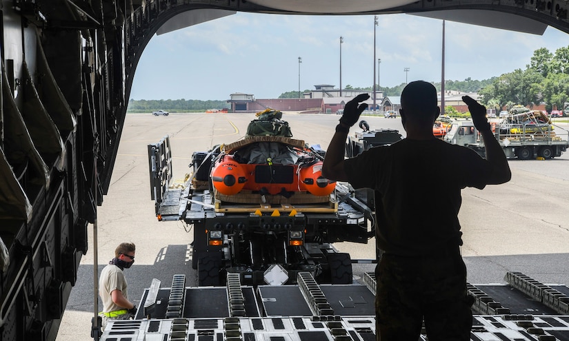 Airmen assigned to both the 437th Aerial Port Squadron, Joint Base Charleston, S.C., and 144th Airlift Squadron, Joint Base Elmendorf-Richardson, Alaska, load search and rescue equipment on board a Joint Base Charleston C-17 Globemaster III for launch July 31st, 2020 at the JB Charleston flightline. C-17s from JB Charleston are a part of the NASA human space flight program. As a precautionary measure, U.S. Space Command and the U.S. Air Force assigned teams of search and rescue professionals to stand alert ahead of the launch at Joint Base Charleston, South Carolina; Patrick Air Force Base, Florida; and Joint Base Pearl Harbor-Hickam, Hawaii. The teams are comprised of Pararescuemen, Combat Rescue Officers, and Aircrew Flight Equipment specialists.